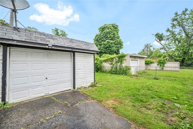 15417 Parkgrove Ave, Cleveland, OH 44110 - garage with asphalt driveway