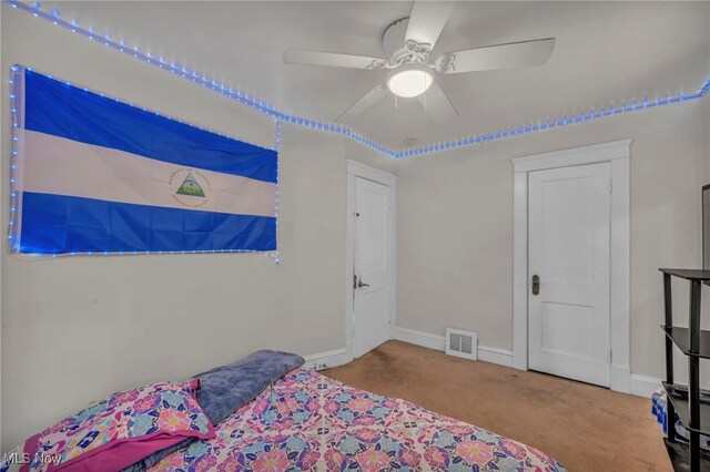15417 Parkgrove Ave, Cleveland, OH 44110 - carpeted bedroom with baseboards and a ceiling fan