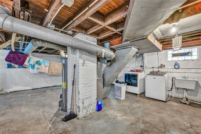 15417 Parkgrove Ave, Cleveland, OH 44110 - basement featuring independent washer and dryer and water heater