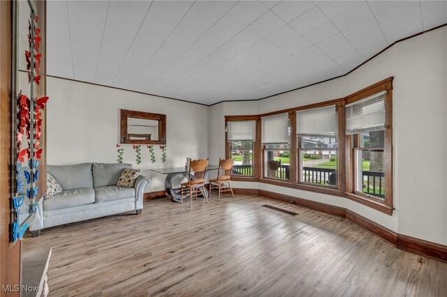15417 Parkgrove Ave, Cleveland, OH 44110 - living area featuring plenty of natural light and wood finished floors