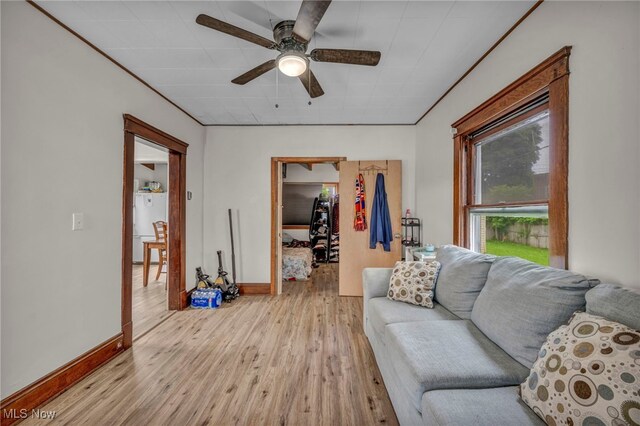 15417 Parkgrove Ave, Cleveland, OH 44110 - living area featuring a ceiling fan and light wood-type flooring