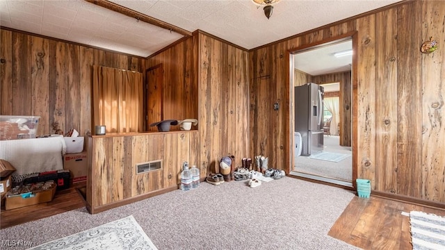 73117 Deck Rd, Freeport, OH 43973 - empty room featuring wood walls, baseboards, carpet, and ornamental molding