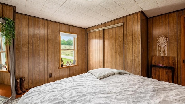 73117 Deck Rd, Freeport, OH 43973 - bedroom featuring wood walls and ornamental molding