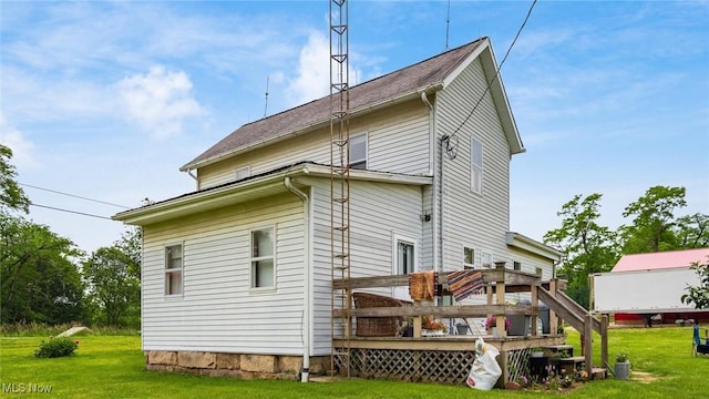 73117 Deck Rd, Freeport, OH 43973 - rear view of property with a yard and a wooden deck