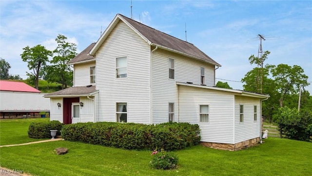 73117 Deck Rd, Freeport, OH 43973 - view of side of property with a lawn and a shingled roof