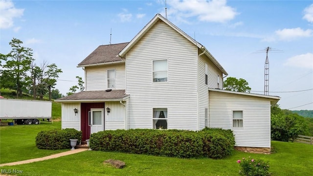 73117 Deck Rd, Freeport, OH 43973 - rear view of property with a lawn and roof with shingles