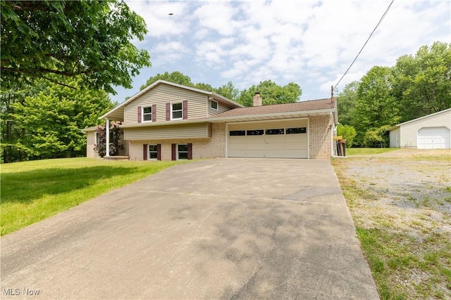 41510 Alderlick Rd, Wellsville, OH 43968 - tri-level home with brick siding, a front yard, concrete driveway, and an attached garage