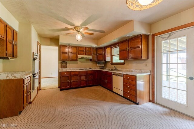41510 Alderlick Rd, Wellsville, OH 43968 - kitchen featuring dishwashing machine, light colored carpet, under cabinet range hood, and light countertops