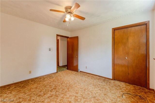 41510 Alderlick Rd, Wellsville, OH 43968 - unfurnished bedroom featuring carpet flooring, baseboards, a closet, and ceiling fan