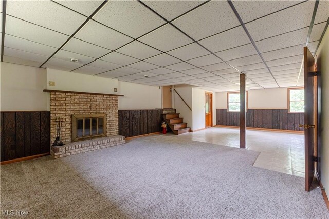 41510 Alderlick Rd, Wellsville, OH 43968 - below grade area featuring wooden walls, wainscoting, stairs, a paneled ceiling, and carpet flooring