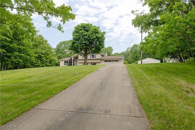 41510 Alderlick Rd, Wellsville, OH 43968 - split level home with a garage and a front lawn