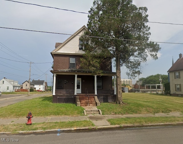 722 High Ave NW, Canton, OH 44703 - traditional style home with a porch and a front yard