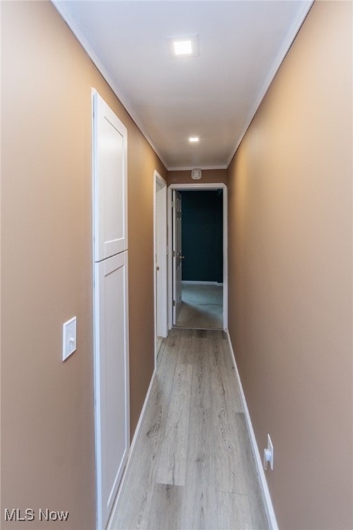 10229 State Rd, North Royalton, OH 44133 - hall featuring crown molding, light wood-style floors, and baseboards