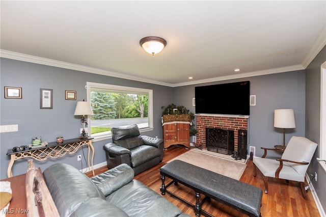 10229 State Rd, North Royalton, OH 44133 - living room featuring wood finished floors, baseboards, crown molding, a brick fireplace, and recessed lighting