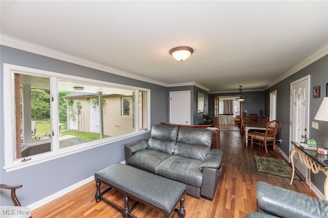 10229 State Rd, North Royalton, OH 44133 - living area featuring wood finished floors, baseboards, and crown molding