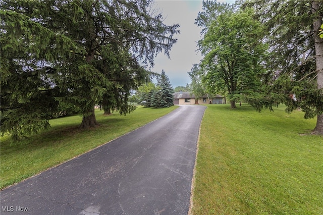 10229 State Rd, North Royalton, OH 44133 - obstructed view of property with a front lawn and driveway