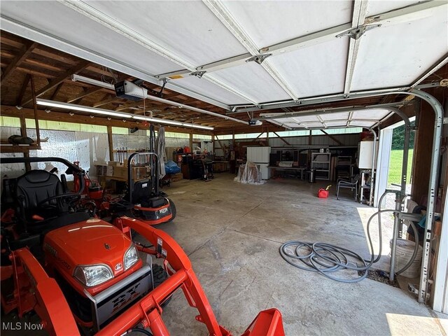 5301 S Ridge Rd W, Ashtabula, OH 44004 - garage featuring a garage door opener