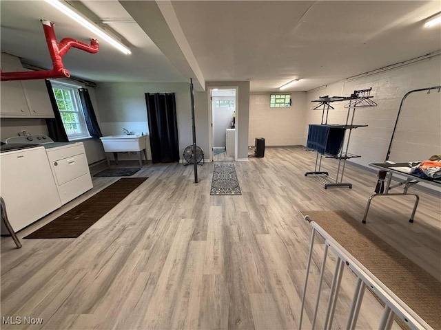 5301 S Ridge Rd W, Ashtabula, OH 44004 - interior space with separate washer and dryer, light wood-style flooring, healthy amount of natural light, and a sink