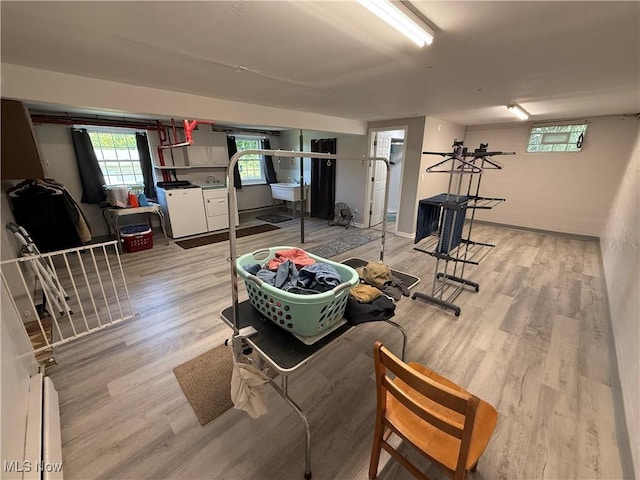 5301 S Ridge Rd W, Ashtabula, OH 44004 - living room featuring washer and clothes dryer and light wood finished floors