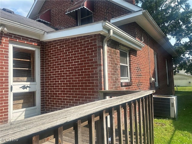 307 N 8th St, Coshocton, OH 43812 - view of side of property featuring brick siding and central air condition unit