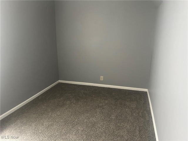 307 N 8th St, Coshocton, OH 43812 - spare room with dark carpet and baseboards