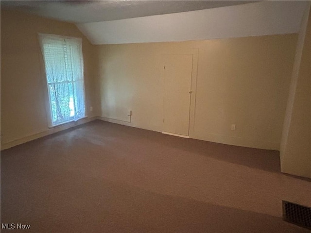 307 N 8th St, Coshocton, OH 43812 - carpeted empty room featuring vaulted ceiling