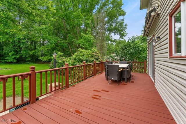 2322 Westview Rd, Cortland, OH 44410 - wooden terrace featuring outdoor dining area, a yard, and view of scattered trees