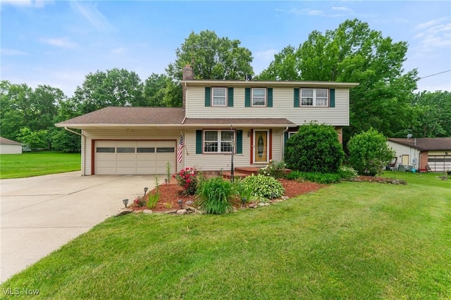 2322 Westview Rd, Cortland, OH 44410 - view of front of house with an attached garage, driveway, a chimney, and a front lawn