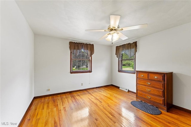 2322 Westview Rd, Cortland, OH 44410 - unfurnished bedroom with light wood-type flooring, baseboards, and ceiling fan