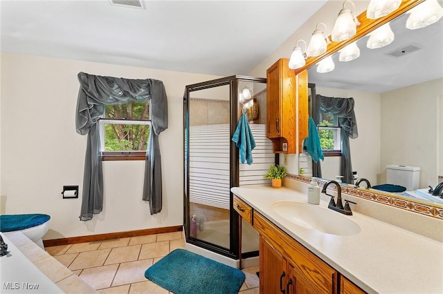 2322 Westview Rd, Cortland, OH 44410 - full bath with toilet, vanity, a shower stall, baseboards, and tile patterned floors