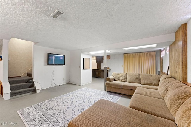 2322 Westview Rd, Cortland, OH 44410 - living area with stairway, a textured ceiling, and concrete flooring