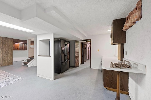 2322 Westview Rd, Cortland, OH 44410 - finished basement with black refrigerator with ice dispenser, a textured ceiling, baseboards, and stairway