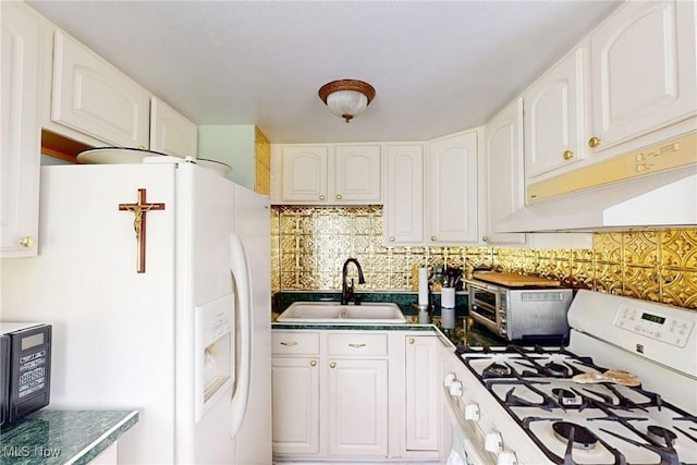 132 Karen Pl, Wintersville, OH 43953 - kitchen featuring white appliances, a sink, backsplash, white cabinetry, and dark countertops