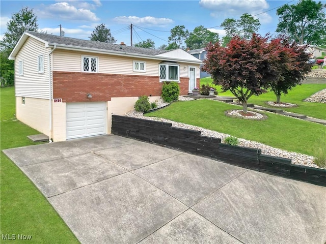 132 Karen Pl, Wintersville, OH 43953 - ranch-style home with brick siding, an attached garage, a front yard, and concrete driveway
