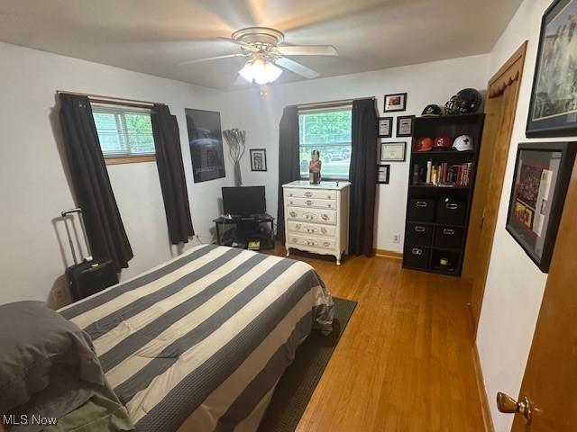 3232 Circle Dr, Cortland, OH 44410 - bedroom featuring wood finished floors and ceiling fan