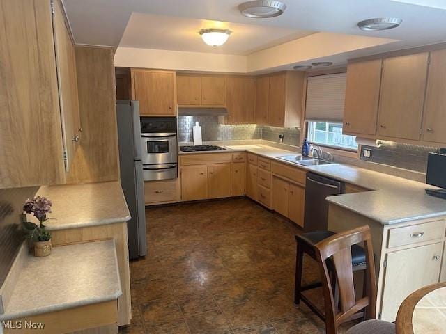 3232 Circle Dr, Cortland, OH 44410 - kitchen featuring dishwashing machine, stainless steel oven, a warming drawer, gas stovetop, and freestanding refrigerator