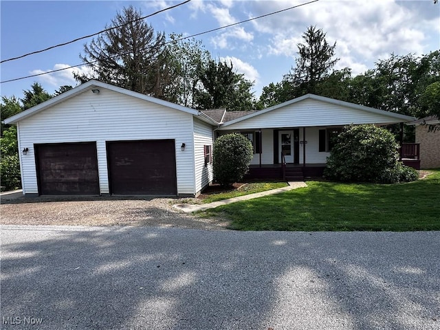 1029 Fowler Dr, Caldwell, OH 43724 - ranch-style house with covered porch, a front yard, and a garage