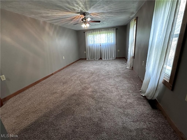 1029 Fowler Dr, Caldwell, OH 43724 - carpeted empty room with ceiling fan and baseboards