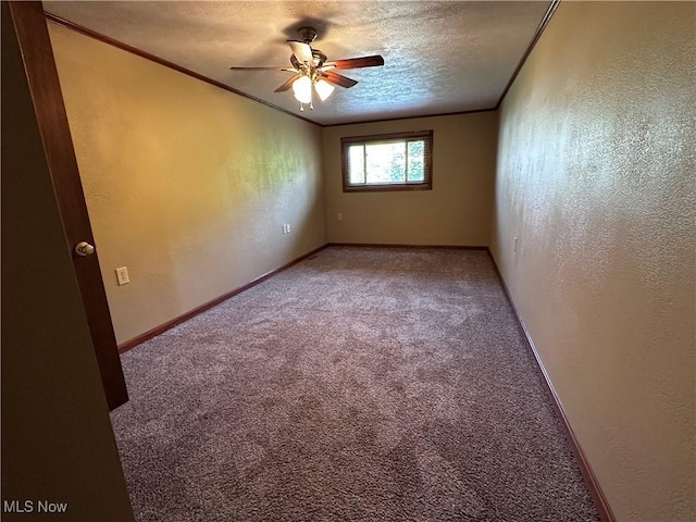 1029 Fowler Dr, Caldwell, OH 43724 - empty room with ornamental molding, carpet floors, ceiling fan, a textured wall, and baseboards