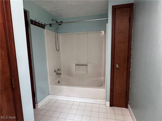 1029 Fowler Dr, Caldwell, OH 43724 - bathroom with baseboards, bathtub / shower combination, and tile patterned floors
