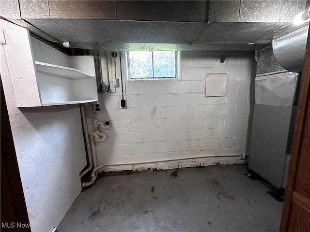 1029 Fowler Dr, Caldwell, OH 43724 - below grade area with heating unit and concrete block wall