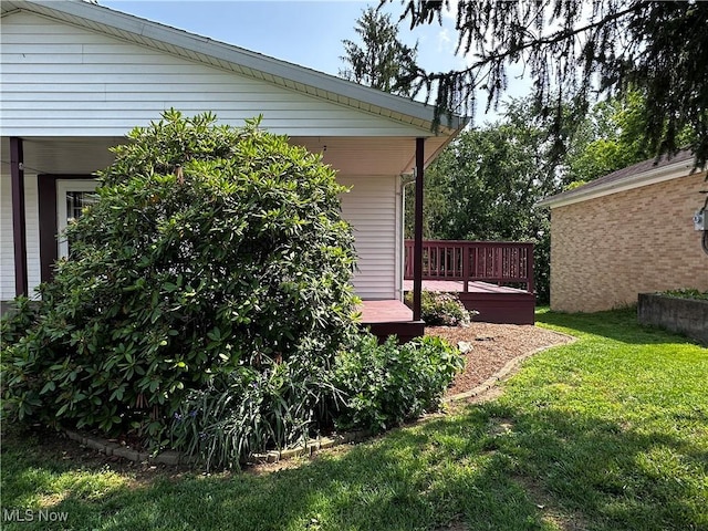 1029 Fowler Dr, Caldwell, OH 43724 - view of grassy yard featuring a deck