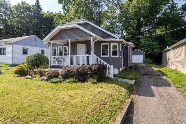 1168 Onondago Ave, Akron, OH 44305 - bungalow-style home with driveway, covered porch, a garage, an outdoor structure, and a front yard
