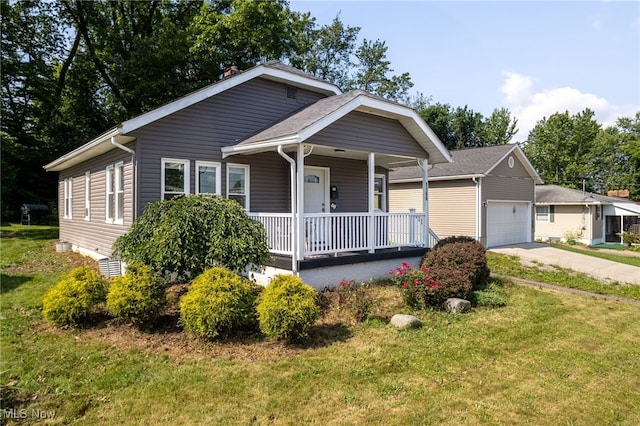 1168 Onondago Ave, Akron, OH 44305 - view of front of home with a porch, a front lawn, and concrete driveway