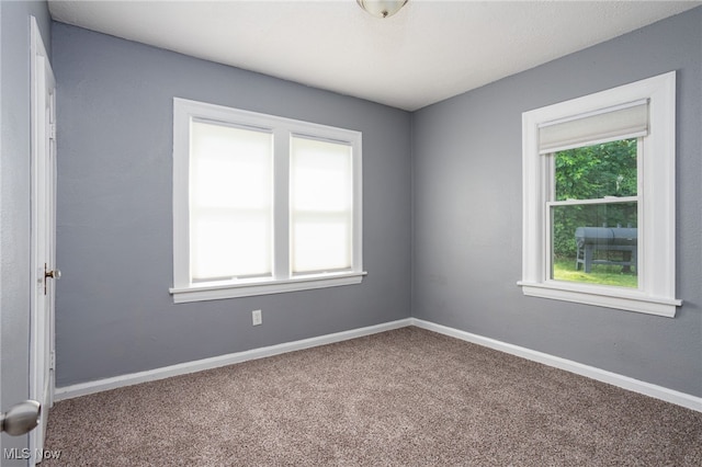 1168 Onondago Ave, Akron, OH 44305 - spare room featuring carpet floors and baseboards