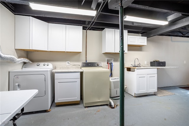 1168 Onondago Ave, Akron, OH 44305 - washroom with cabinet space and independent washer and dryer