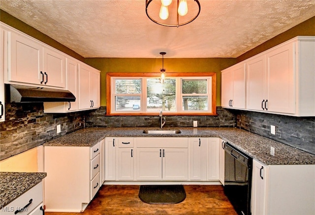 3811 Amherst Ave NW, Massillon, OH 44646 - kitchen with dishwasher, white cabinets, dark wood-style floors, under cabinet range hood, and backsplash