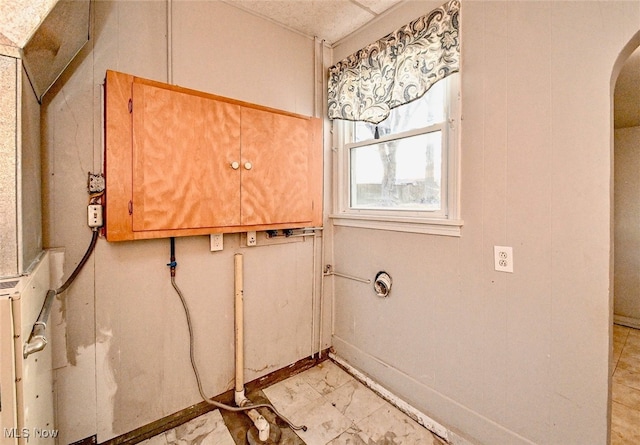 3811 Amherst Ave NW, Massillon, OH 44646 - laundry room with arched walkways and light marble finish floors