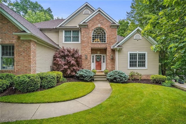 2634 Deer Ridge Run, Cuyahoga Falls, OH 44223 - traditional-style home featuring brick siding and a front lawn