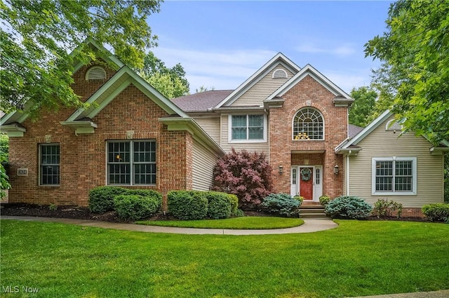 2634 Deer Ridge Run, Cuyahoga Falls, OH 44223 - traditional-style home with brick siding and a front lawn
